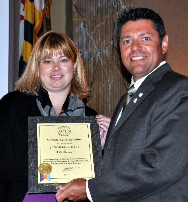 Jennifer Havermann, Raytheon, receives a Lifetime Membership Award from Ed Grimes, chapter president, at the September luncheon.